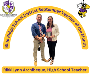 Teacher of the month with the principal under BRUSD banner September Teacher of the Month